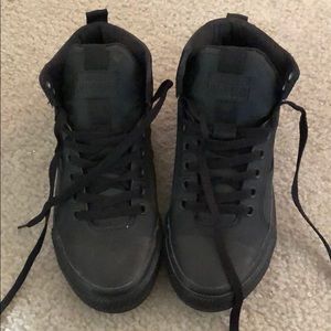 Black-on-Black high top Converse All Stars